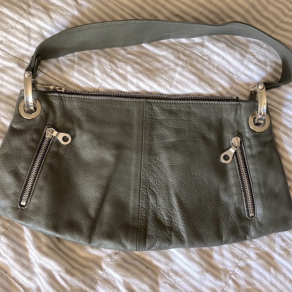 Gorgeous grey green leather purse by Christopher Kon Montreal.  Vgood condition.